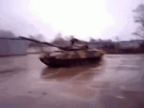 Tank Driving Through Flooded Parking Lot