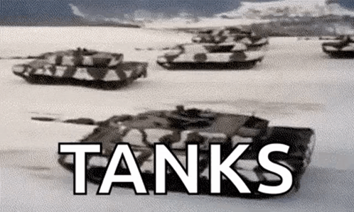 Tanks Driving Through Snow Field