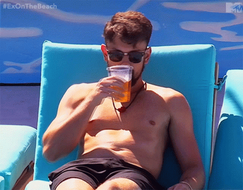Tanning And Relaxing With Beer GIF