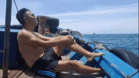 Tanning On Fishing Vessel GIF