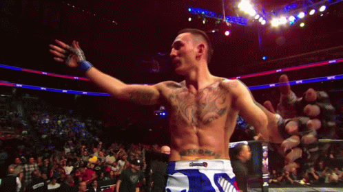 Tattooed Man in Boxing Ring