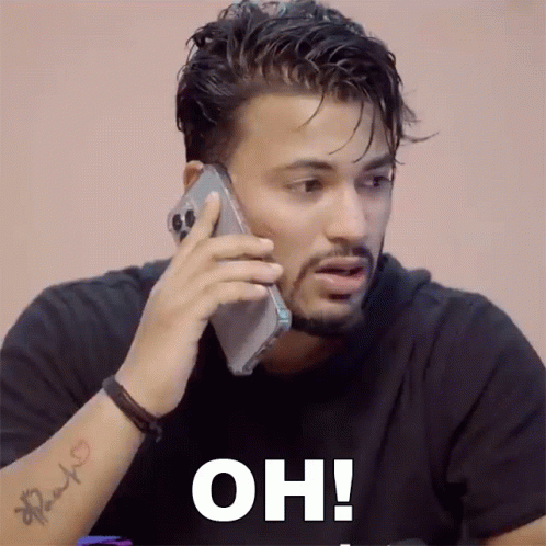Tattooed Man Talking on Cell Phone Oh