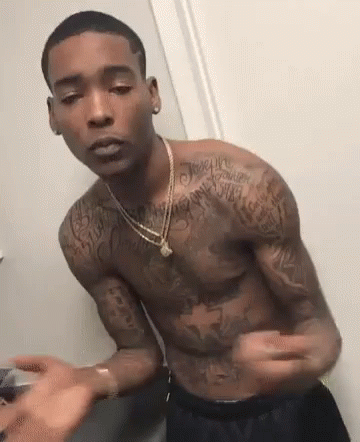 Tattooed Shirtless Man in Bathroom Mirror