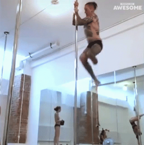 Tattooed Up Man Pole Dancing GIF