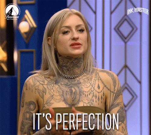 Tattooed Woman Says It's Perfection On A Screen GIF