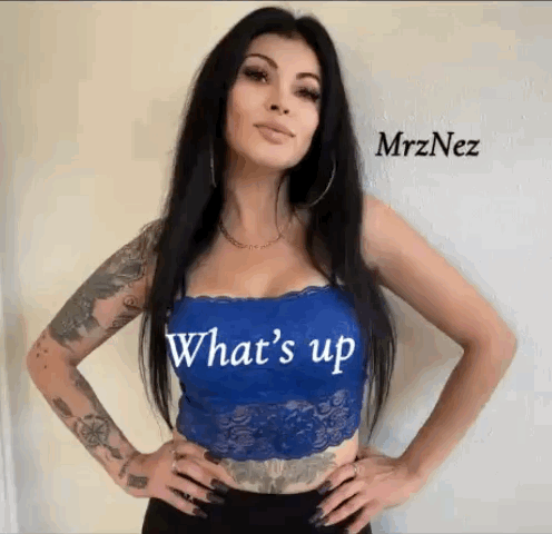 Tattooed Woman Wearing Blue Lace Top Saying Whats Up