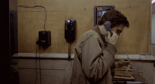 Taxi Driver Travis Bickle Using Telephone GIF
