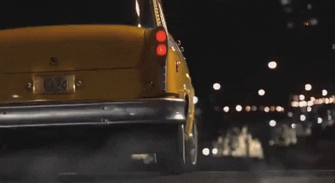 Taxi Moving On Road With Christmas Lights GIF