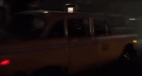Taxi Splashing Water As It Drives By GIF