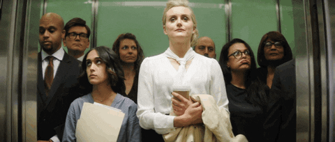 Taylor Schilling With Other People Inside Elevator GIF