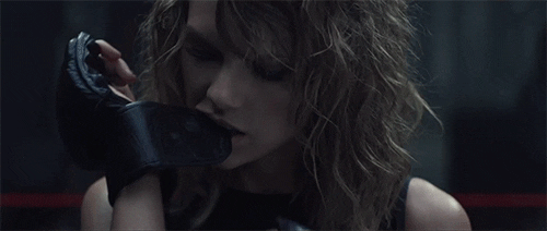 Taylor Swift Bites Gloves GIF