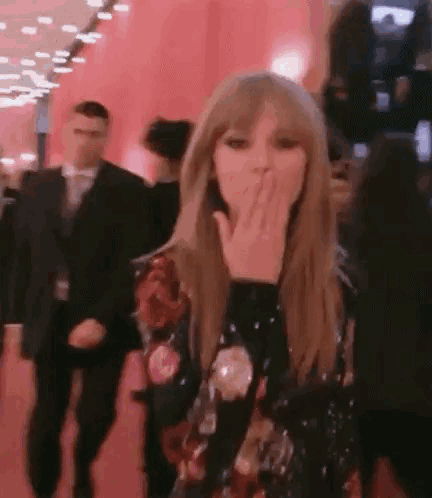 Taylor Swift Blowing A Kiss On Red Carpet GIF