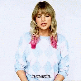 Taylor Swift Wearing Blue and White Sweater
