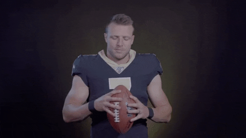 Taysom Hill Extending Hand Holding Football Forward GIF