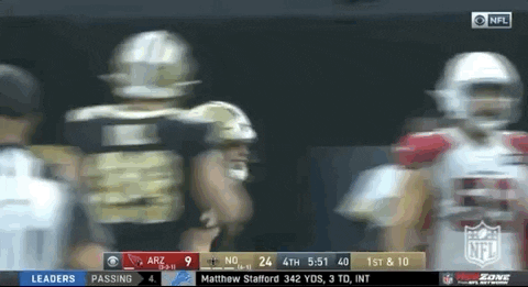 Taysom Hill Leaping While Holding Football GIF