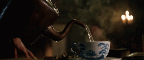 Tea Being Poured From Kettle Into Cup GIF