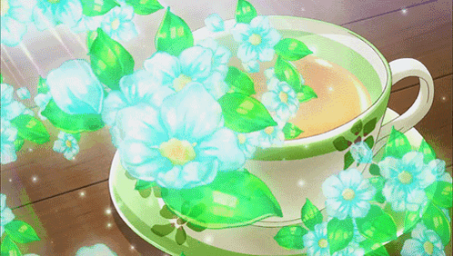 Tea Cup With Blue Flowers and Green Leaves