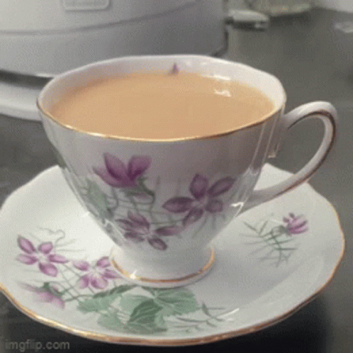 Cup Of Tea On Plate GIF
