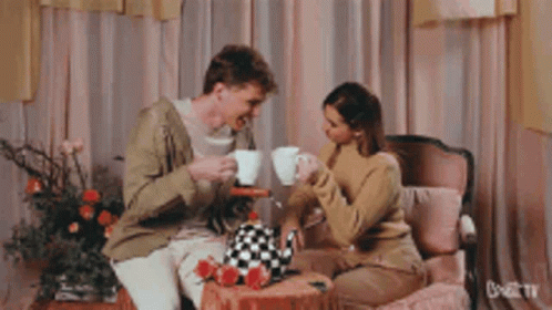 Couple Clinking Cup Of Tea GIF