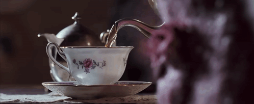 Tea Poured Into Floral Cup GIF