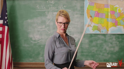 Teacher in Front of Blackboard Telling Tickle Down Effect