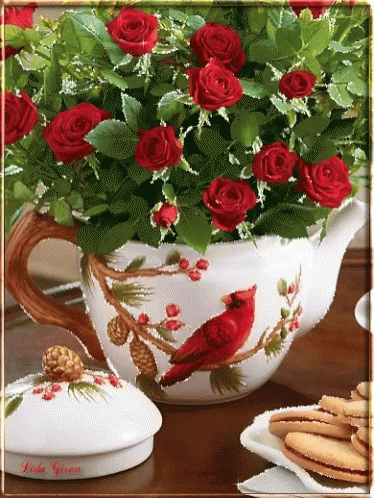 Teapot Filled With Red Roses And Cardinal GIF
