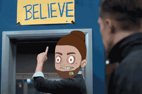 Ted Lasso Animated Head Pointing Believe Sign GIF