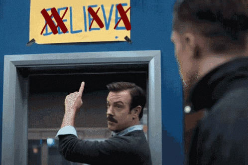 Ted Lasso Believe Sign Marked X GIF