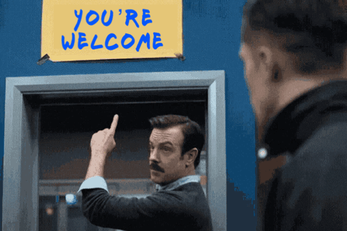 Ted Lasso Believe Sign Replaced With You're Welcome GIF