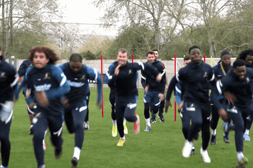 Ted Lasso Colleagues Running GIF