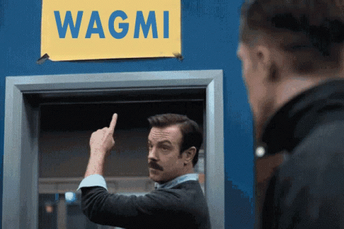 Ted Lasso Points At Believe Sign Wagmi Replacement GIF