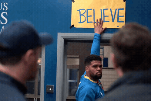 Ted Lasso Team Touches Believe Sign GIF