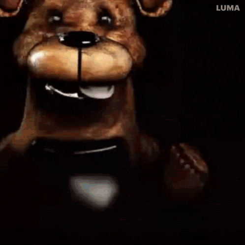 Teddy Bear Close Up With Mouth Open In Dark Room GIF