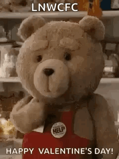 Teddy Bear Holding Heart Saying Happy Valentine's Day GIF