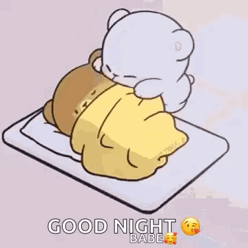 Teddy Bear Lying on Bed With Blanket