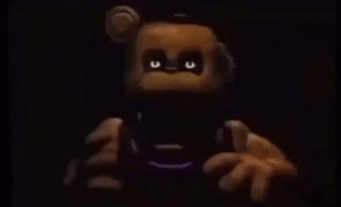 Teddy Bear With Glowing Eyes Holding Remote Control
