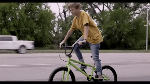 Teenage Boy Stand Riding Bike GIF