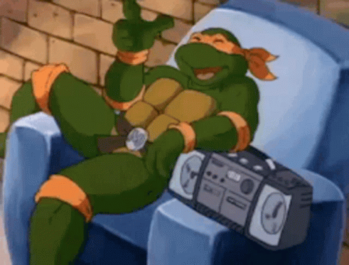 Teenage Mutant Ninja Turtle Sitting In Chair With Boombox GIF