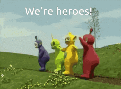Teletubbies Standing In Grassy Field Saying We're Heroes GIF