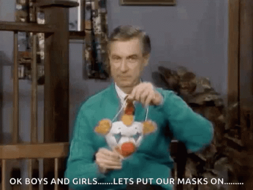 Television Host Fred Rogers Wearing Clown Mask GIF