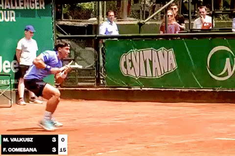 Tennis Match in Front of Ceuvitana Sign