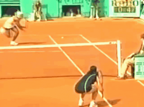 Tennis Player About to Hit Ball