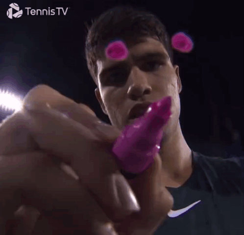 Tennis Player Holding Pink Object