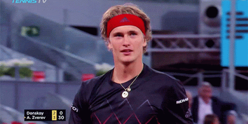 Tennis Player in Red Headband and Black Shirt