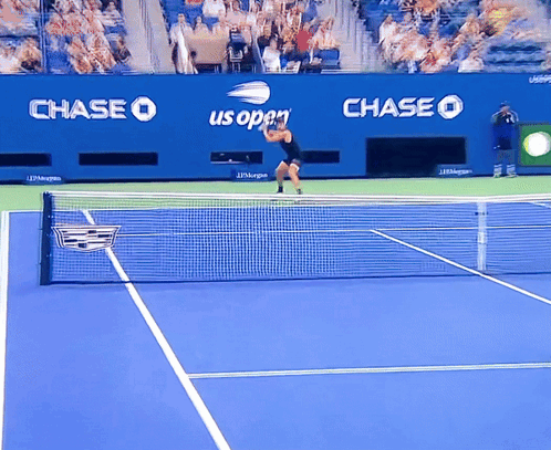 Tennis Player on Blue Court With Chase Us Open Ads