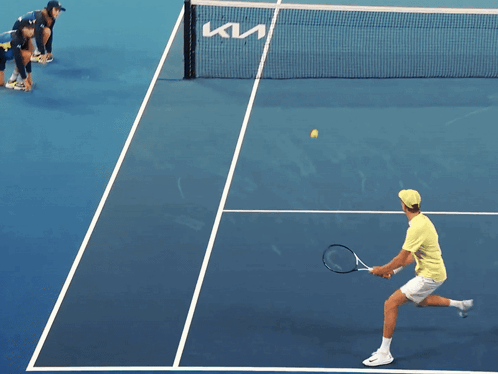 Tennis Player Serving On Blue Court GIF