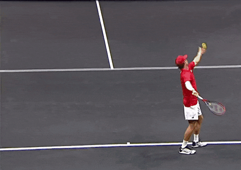 Tennis Player Swinging Racket on Court With AT&T Tour Sign