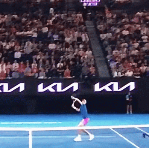 Tennis Player Swinging Racquet In Front Of Kia Ad GIF