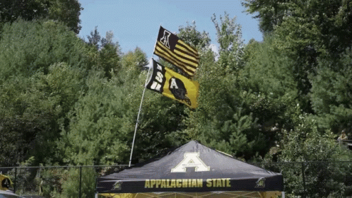Tent Saying Appalachian State In Front of Trees