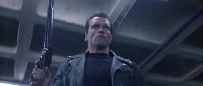 Terminator Arnold Schwarzenegger Holding A Gun GIF